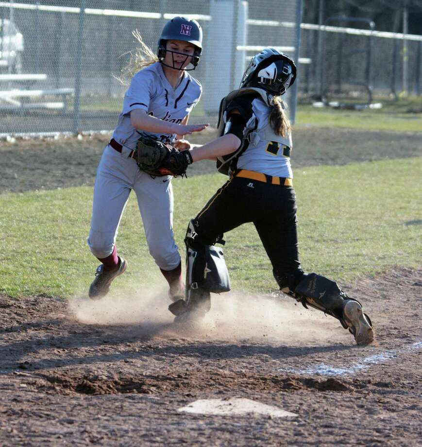 Amity catcher Racheal Crow tags out New Haven pinch-runner Juliana Jones out at the plate for the final out of the 9th inning during a softball game on Wednesday. Photo: Dave Phillips / For Hearst Connecticut Media / Stamford Advocate Freelance