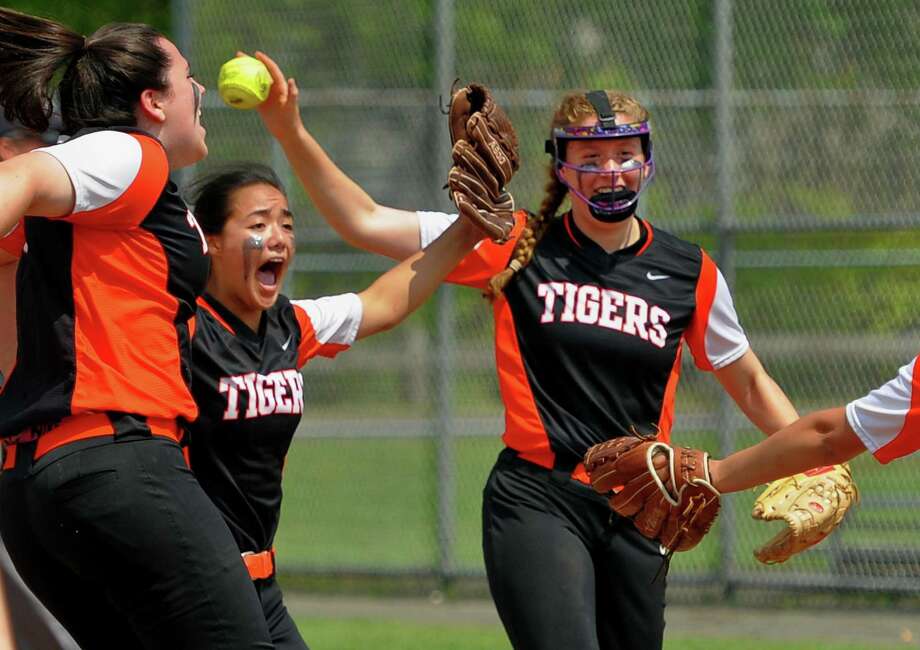 Ridgefield celebrate its win over West Haven during Class LL softball action in West Haven, Conn., on Friday May 31, 2019. Photo: Christian Abraham / Hearst Connecticut Media / Connecticut Post
