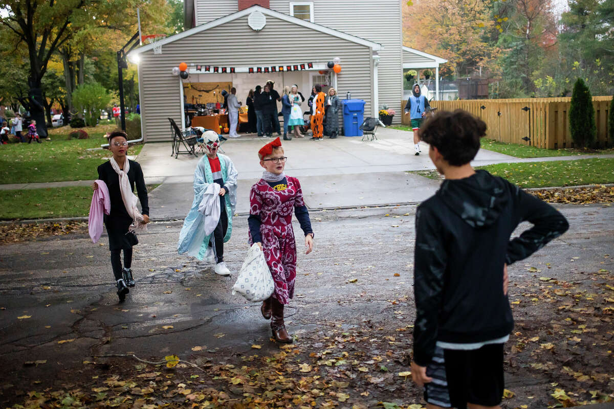 Families Go Trick Or Treating In Midland On Halloween Night