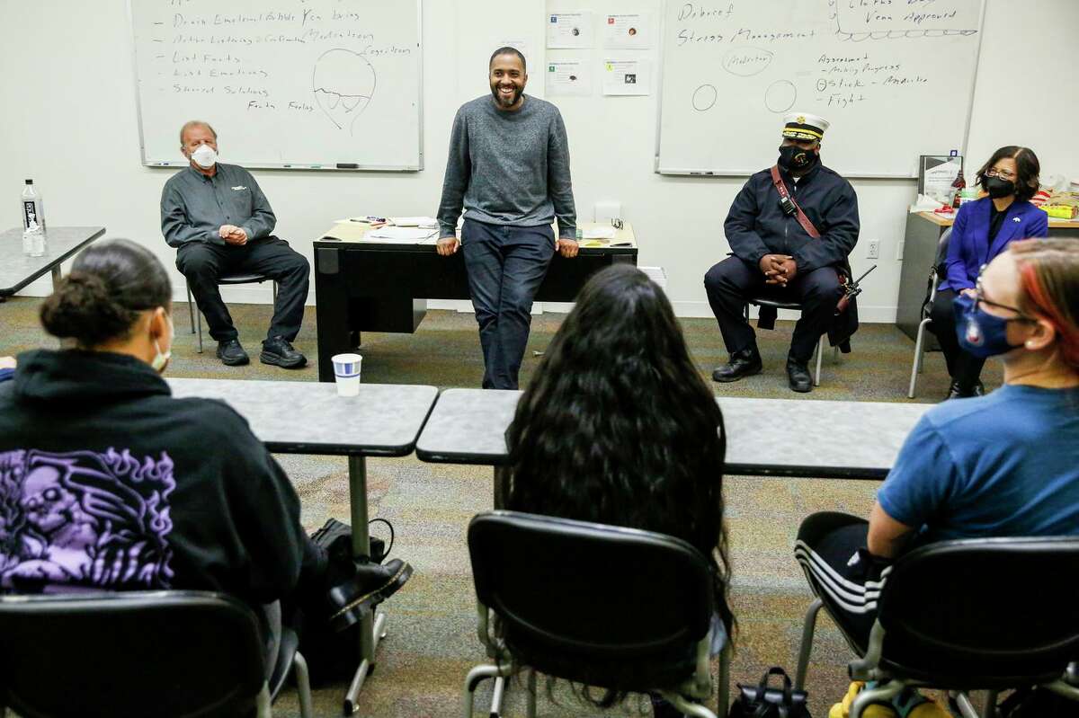 Elliott Jones, MACRO program manager, speaks with the program's team made up of emergency medical technicians and crisis intervention specialists, during a training at Youth Uprising in Oakland.