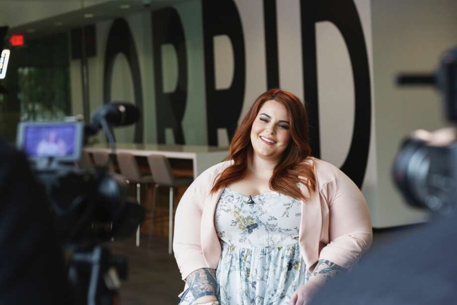 tess holliday poses during a photo shoot for plus-size clothing