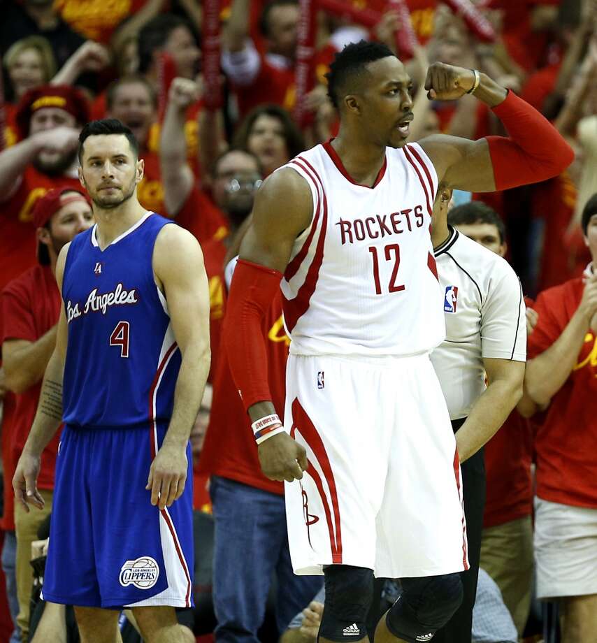 houston rockets center dwight howard (12) reacts to a play as