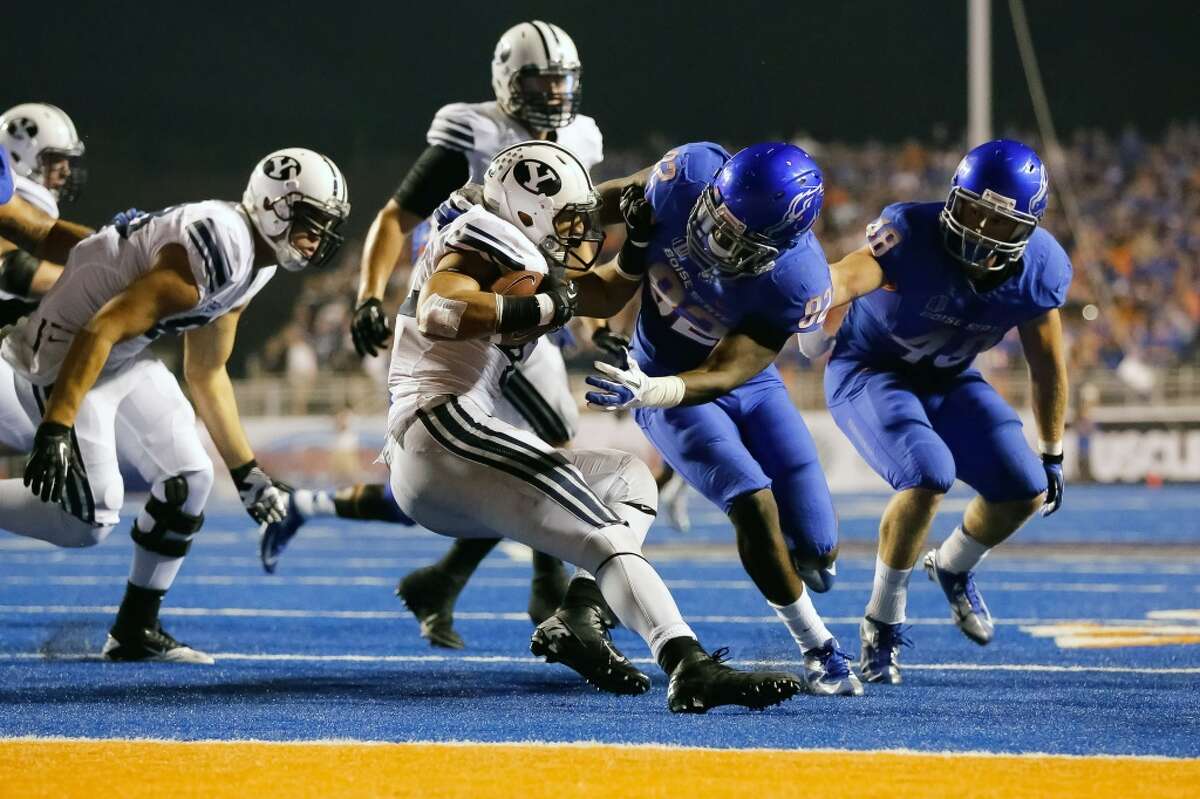 Ukwuachu (second from right) was dismissed from Boise State's football team on May 7, 2013, for