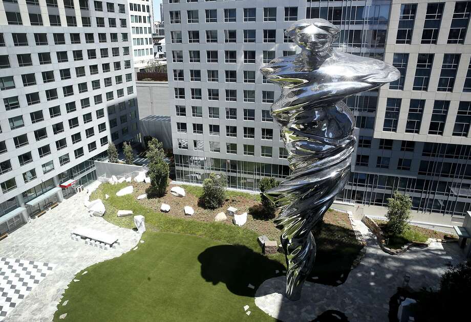 above: artist lawrence argent"s 92-foot-high stainless steel