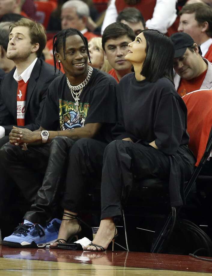 houston, tx - april 18: travis scott and kylie jenner sit court