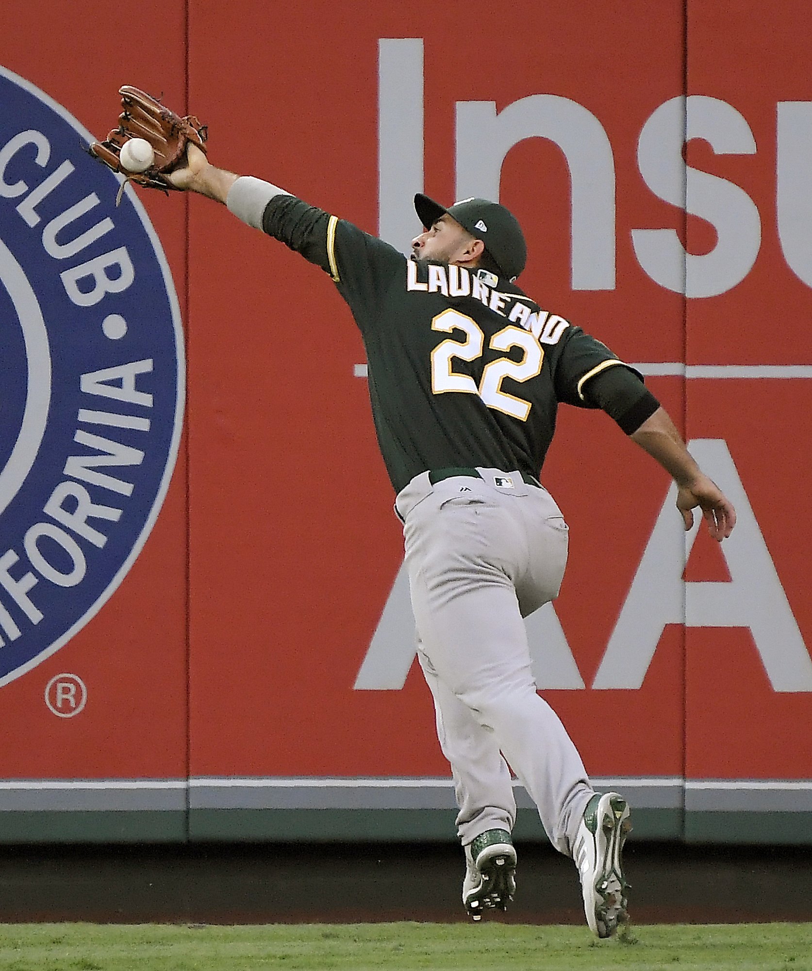 Laureano’s amazing throw headlines win; A’s move 3 1/2 back in West