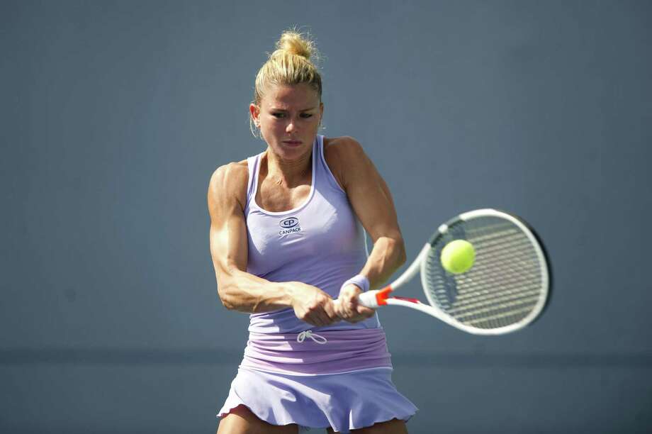 camila giorgi of italy hits a backhand shot during a second