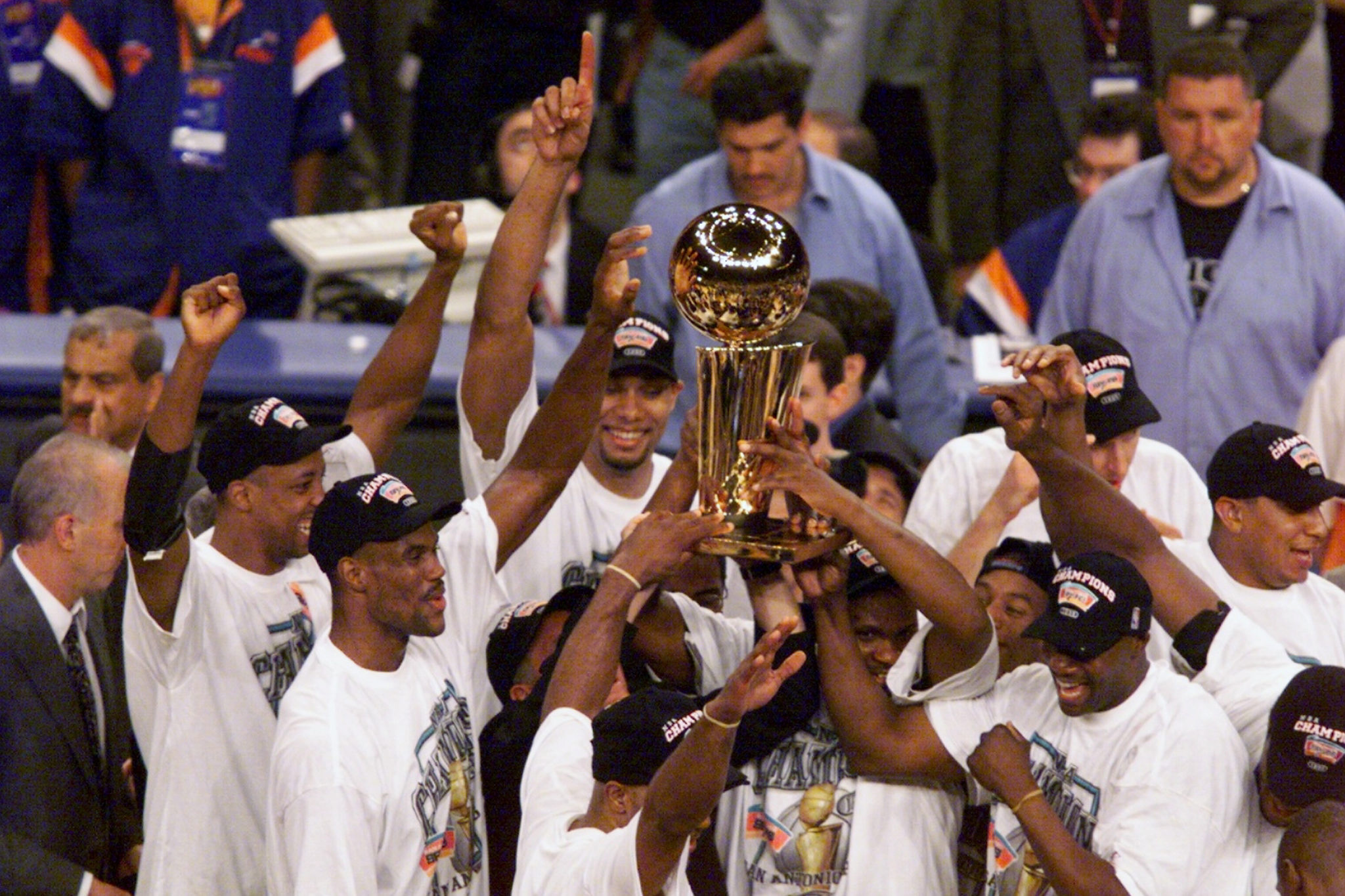 Spurs celebrating at halfcourt after winning the 1999 NBA championship.
