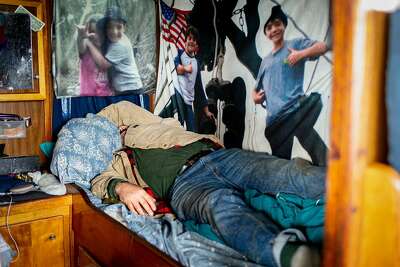 Joe rests on his bunk on the Pioneer