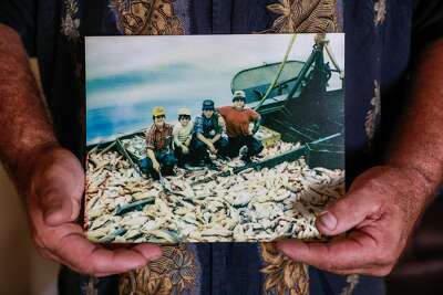 Joe showing a photo of his brothers