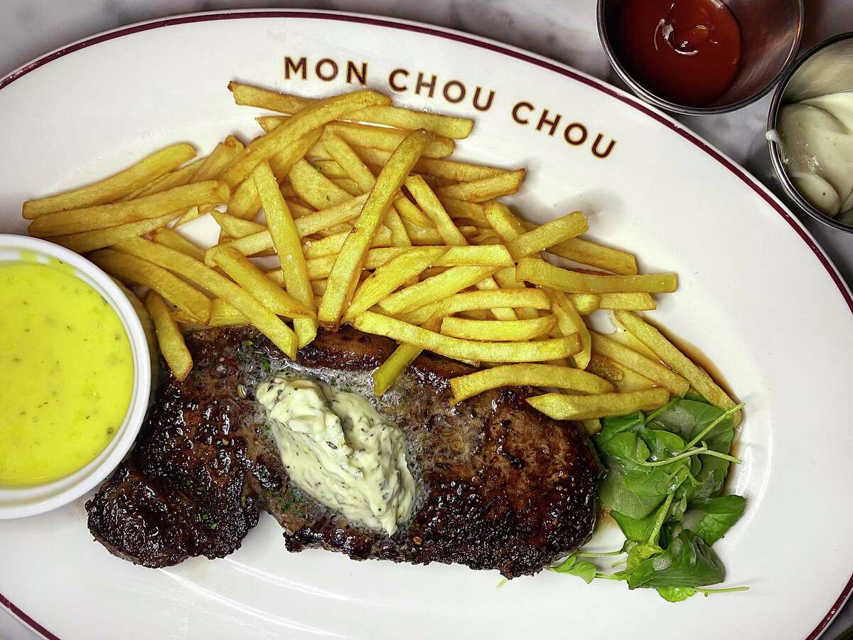 Steak frites can be ordered with a 12-ounce New York strip and a side of bearnaise sauce at Brasserie Mon Chou Chou.
