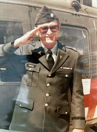 A portrait of U.S. Army Lt. Col. Howard Preece photographed next to an Army medical helicopter some time during his enlistment between 1980 and 1988.