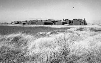 Once known as Brewer’s Island, a marshy dairy farm was reborn as Foster City, beginning in the early 1960s. This 1974 photograph shows a newly completed housing tract.