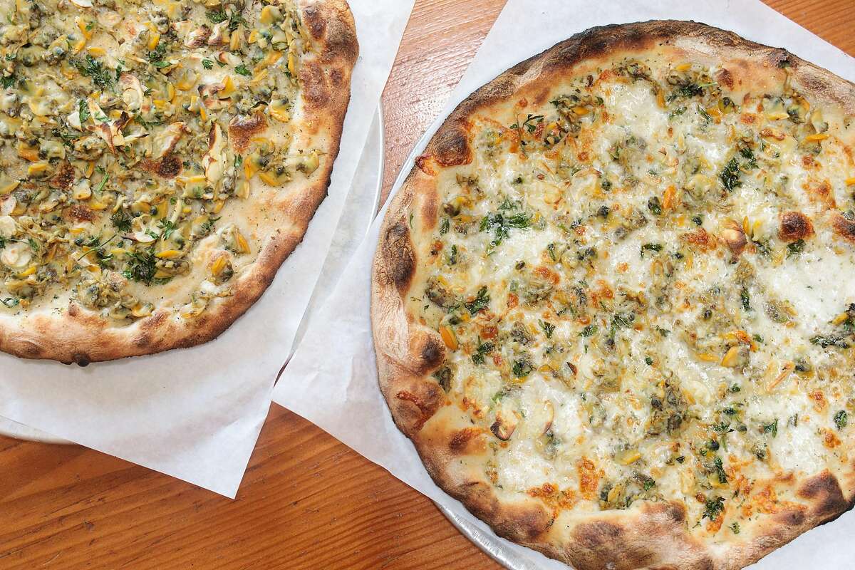 Two white clam pizzas