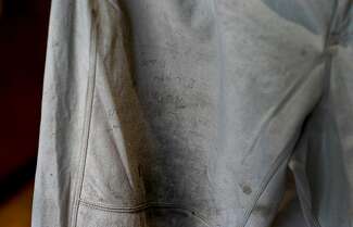 Photos of a note scribbled on Ron Bolen’s pants.