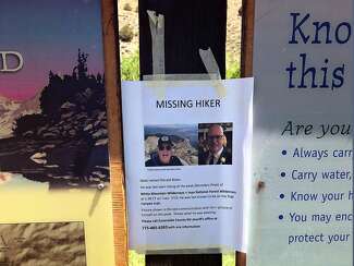 Photo of a missing-person poster of his friend Ron Bolen that Mark McConnell taped to the Boundary Peak trailhead sign.