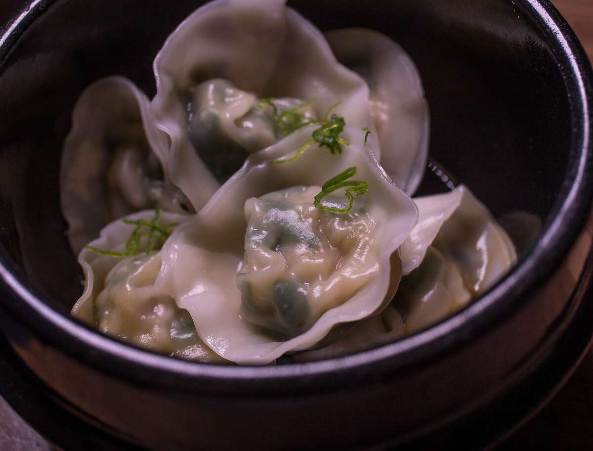 Steamed scallop dumplings in a small dish.