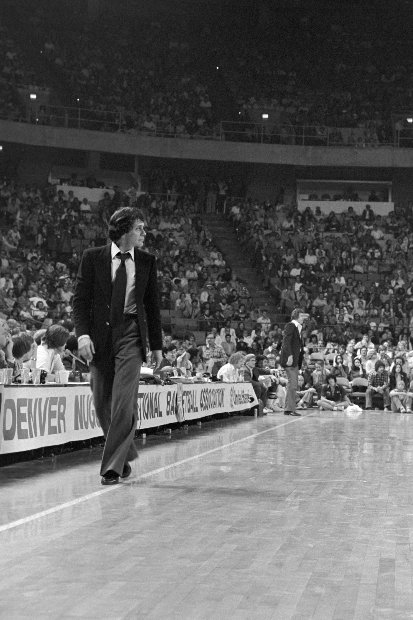 Larry Brown walking the sidelines during an NBA game.