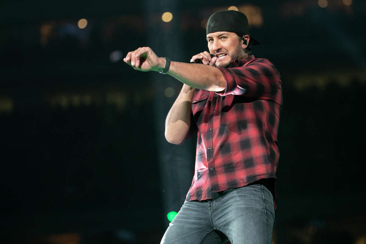 Photos from the Houston Rodeo crowd as Luke Bryan gets NRG Stadium dancing