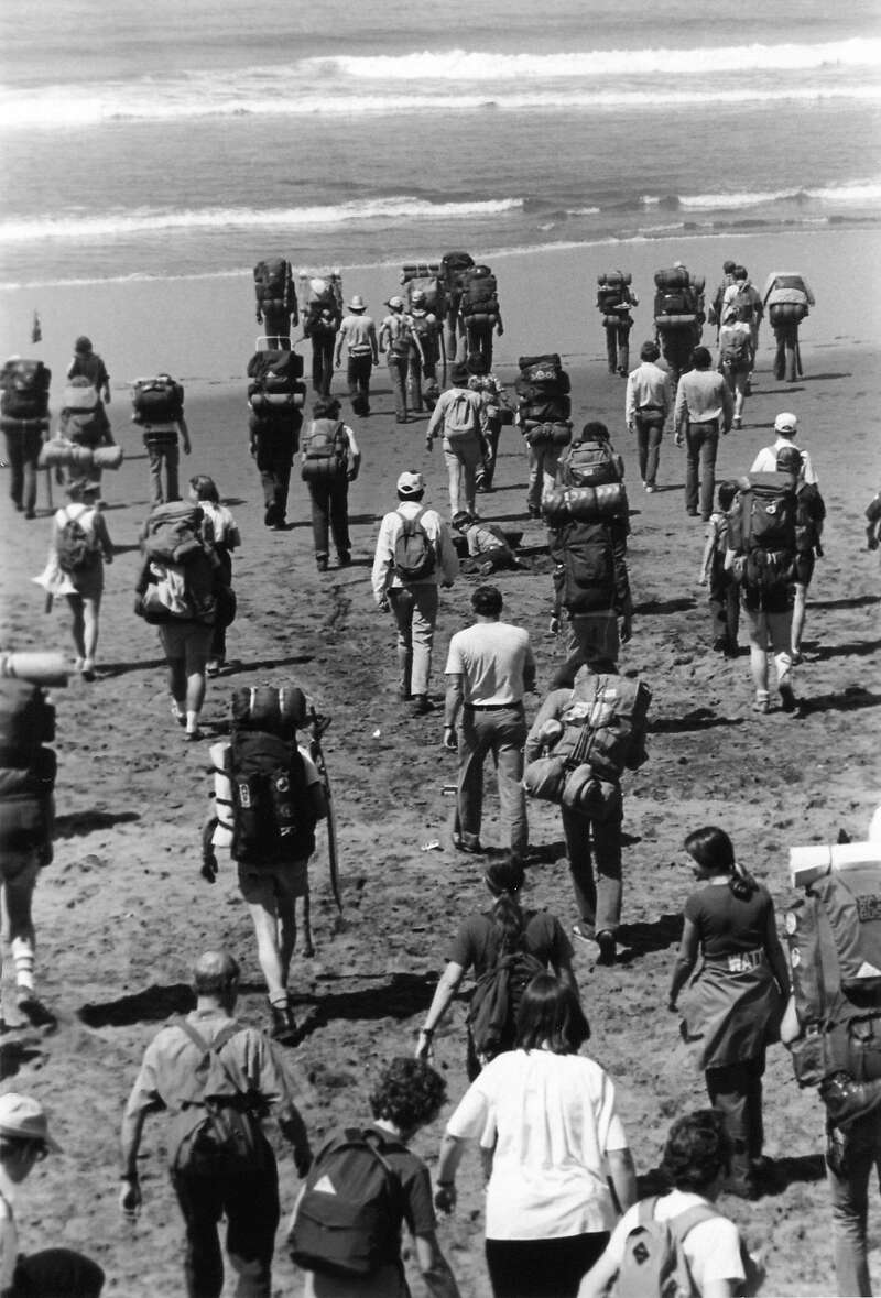 Hikanation backpackers arrive at Ocean Beach to dip their boots in the Pacific Ocean before their cross-country hike.
