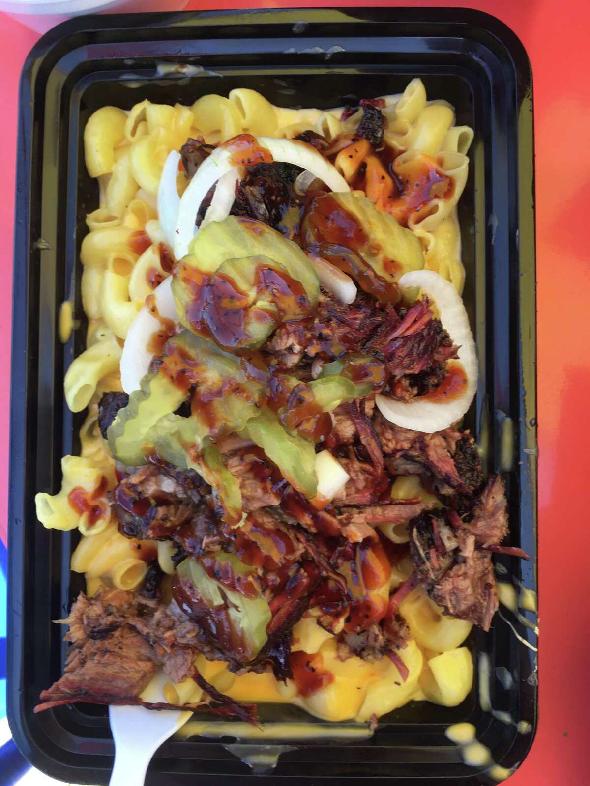 The Mac Attack ($12) at Nano's BBQ is a massive combination of creamy Velveeta-like mac and cheese topped with pickles, onions, barbecue sauce and a heavy-handed mixture of chopped brisket and pulled pork that begs to be shared.