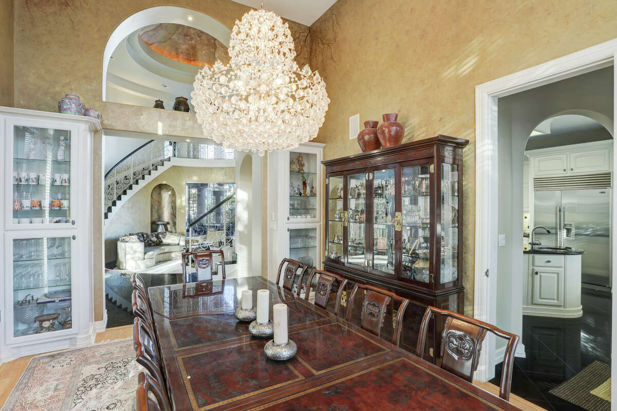 Dining room pictured with chandelier.
