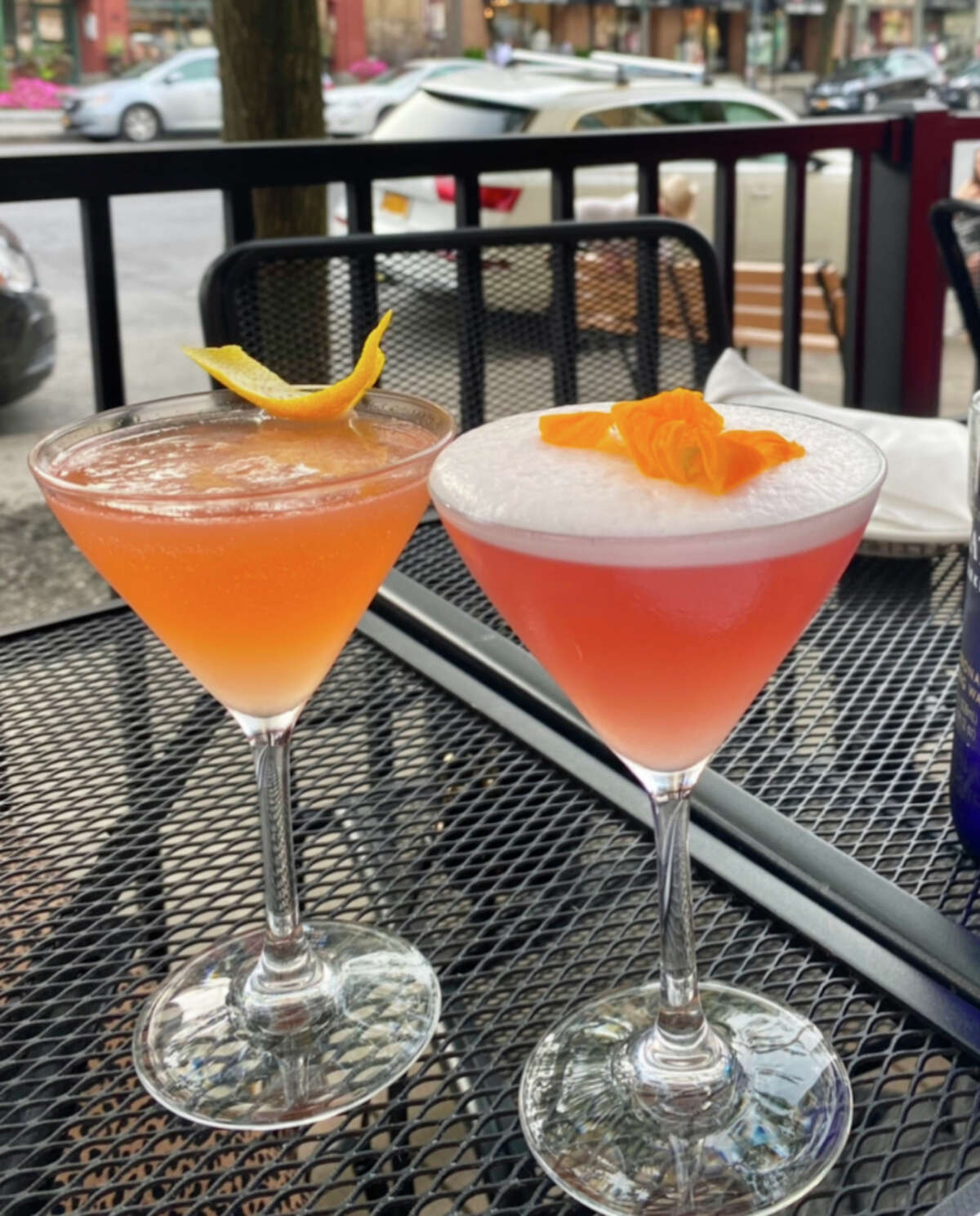 Two cocktails in martini glasses, including the Em’s Gem, on the right.