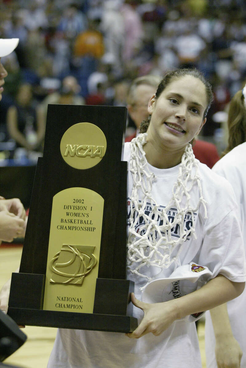 Sue Bird of Connecticut displays the trophy after defeating Oklahoma 82-70 in the NCAA Women's Championship Game at the Alamo Dome in San Antonio,Texas. Connecticut finished their season undefeated. 
