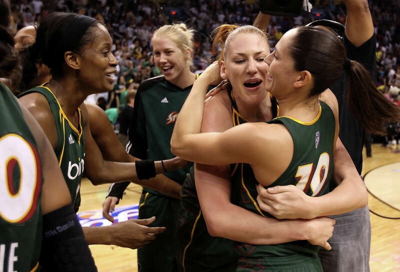 Swin Cash #2, Lauren Jackson #14 and Sue Bird #10 of the Seattle Storm celebrate after defeating the Phoenix Mercury in Game Two of the Western Conference Finals during the 2010 WNBA Playoffs at US Airways Center on September 5, 2010 in Phoenix, Arizona. The Storms defeated the Mercury 91-88 to win the series 2-0. 