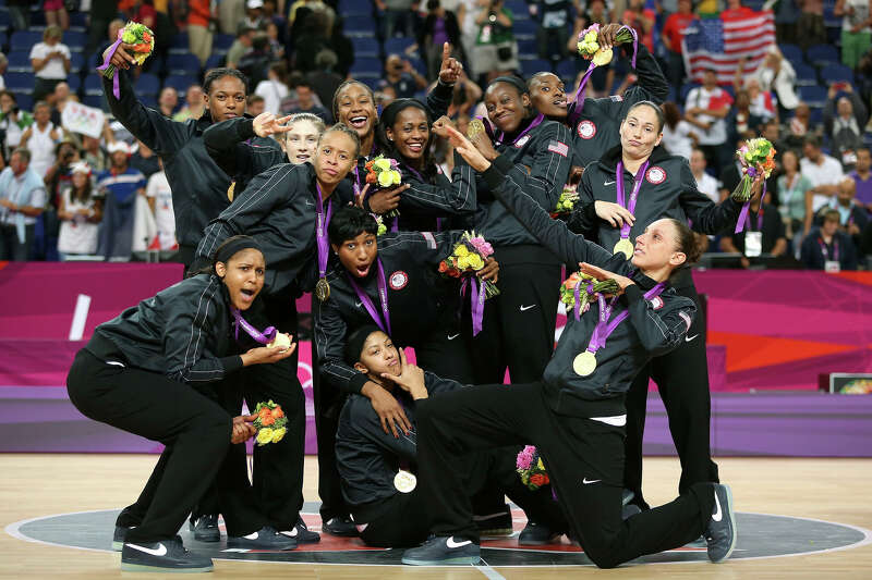 The United States players pose for a photo with their gold medals during the medal ceremony for the Women's Basketball on Day 15 of the London 2012 Olympic Games at North Greenwich Arena on August 11, 2012 in London, England.