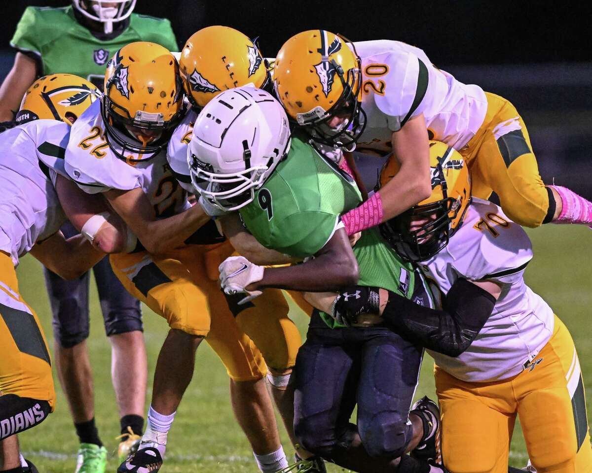A host of Ravena-Coeymans-Selkirk defenders tackle Schalmont receiver Vinny Zido during a game at Schalmont High School in Rotterdam, NY, on Sept. 9, 2022.