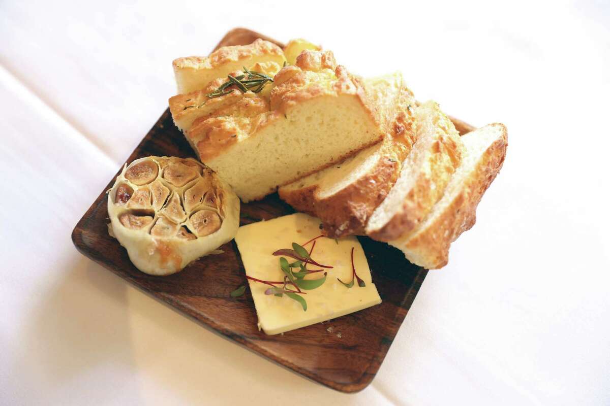 slices of gluten-free focaccia with a pat of butter