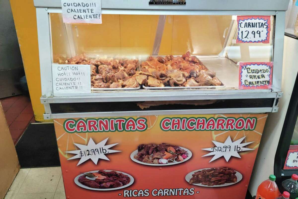 Glass case with carnitas