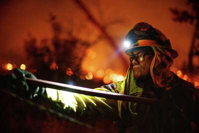 Firefighter with headlamp on.