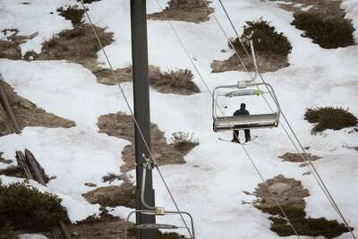 A skier rides a lift at Heavenly Mountain Resort in South Lake Tahoe.