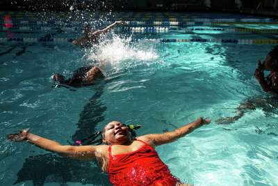 Students play in the water at Martin Luther King Jr. Pool. 