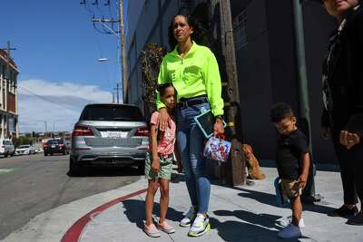 Brooke Jenkins stands at crosswalk with her kids.