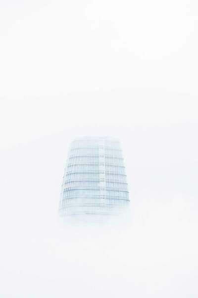 Salesforce Tower through a moody layer of fog.