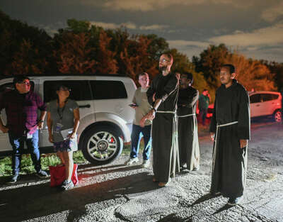 Three Franciscan priests offering support and prayer at the scene of a migrant smuggling tragedy in San Antonio.
