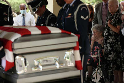 Lorena Platt reacting as the casket of her husband is carried by the Joint Base San Antonio Honor Guard during a burial ceremony at Fort Sam Houston National Cemetery.