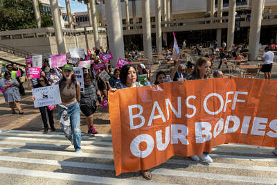 Students marching for reproductive justice on campus at UTSA.