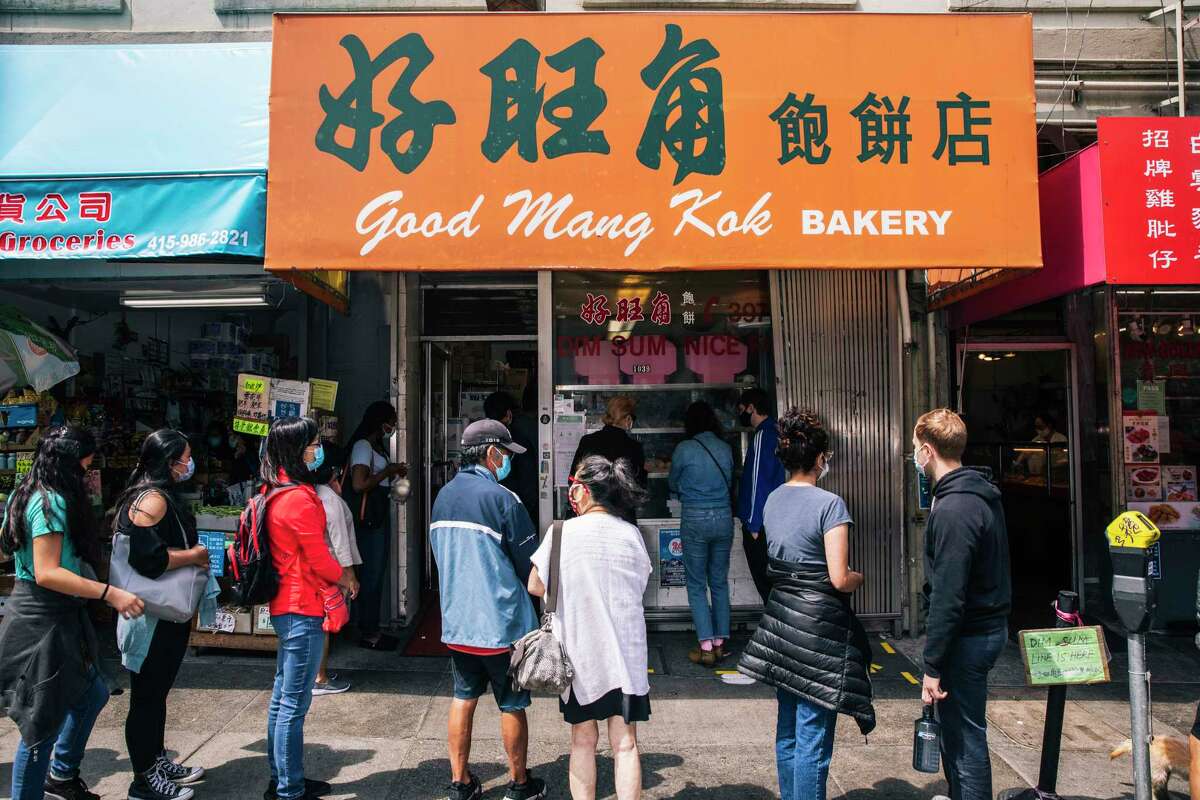 People wait in a long line for dim sum at Good Mong Kok Bakery