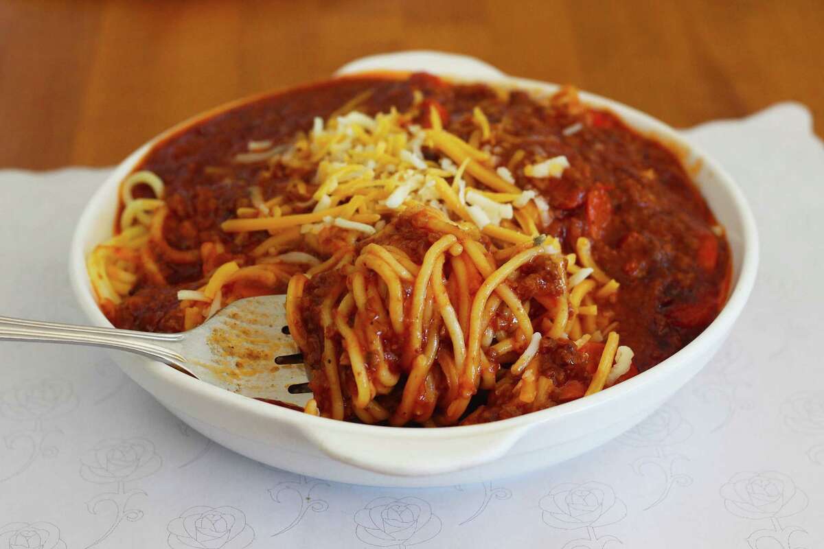 Spaghetti in a red sauce twirled around a fork
