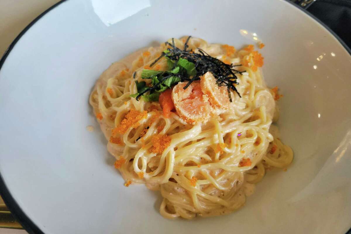 Spaghetti topped with fish roe and seaweed strips
