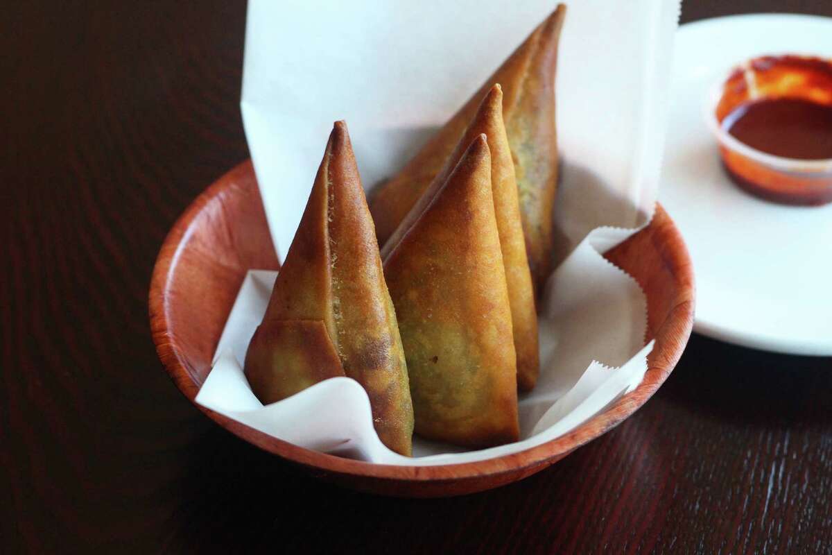 Sambussas, fried triangle packages filled with lentils