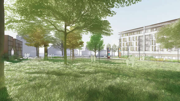 A rendering shows a grassy field in people's park along with some trees. Some buildings can be seen in the background to the left and right sides.