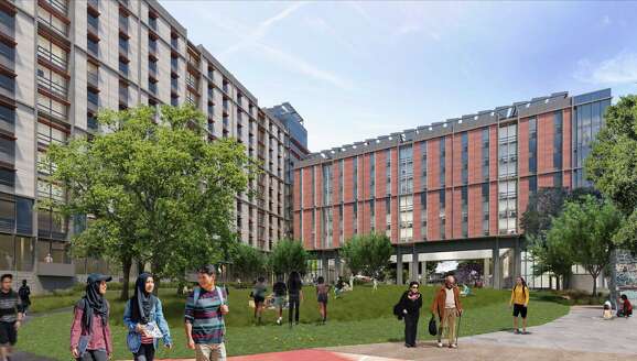A rendering of People's Park shows the side of a T-shaped building, where students will be housed. One of the wings of the building is partially raised off the ground so people can walk beneath it.