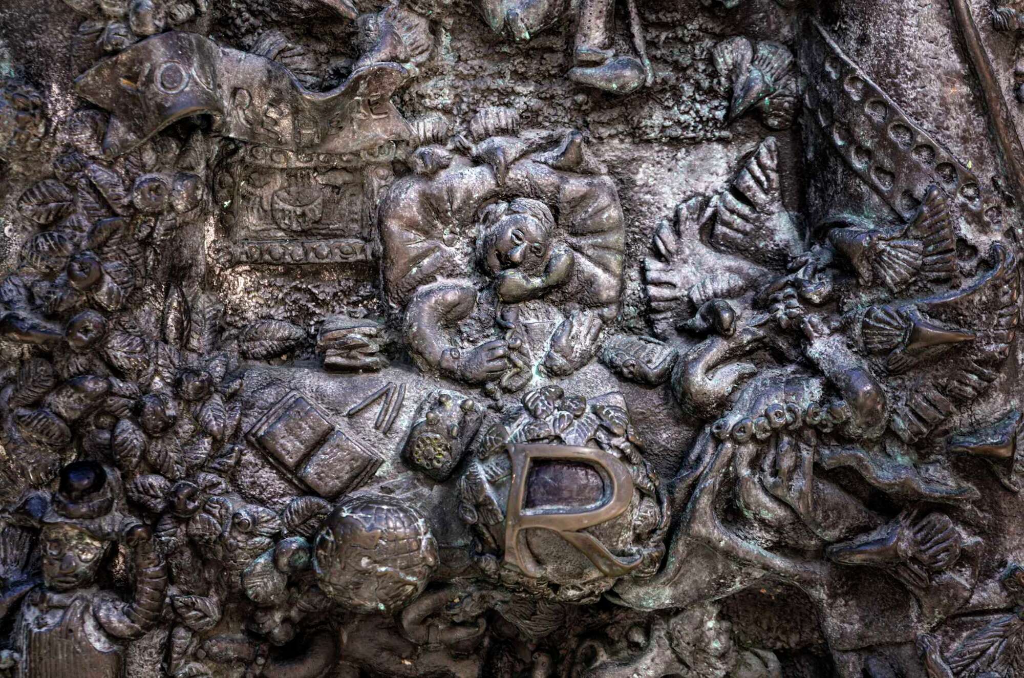 A detail photo of Ruth Asawa's "San Francisco Fountain" shows Donald Pritzker, owner of the Grand Hyatt San Francisco who commissioned the sculpture, on a phone call.