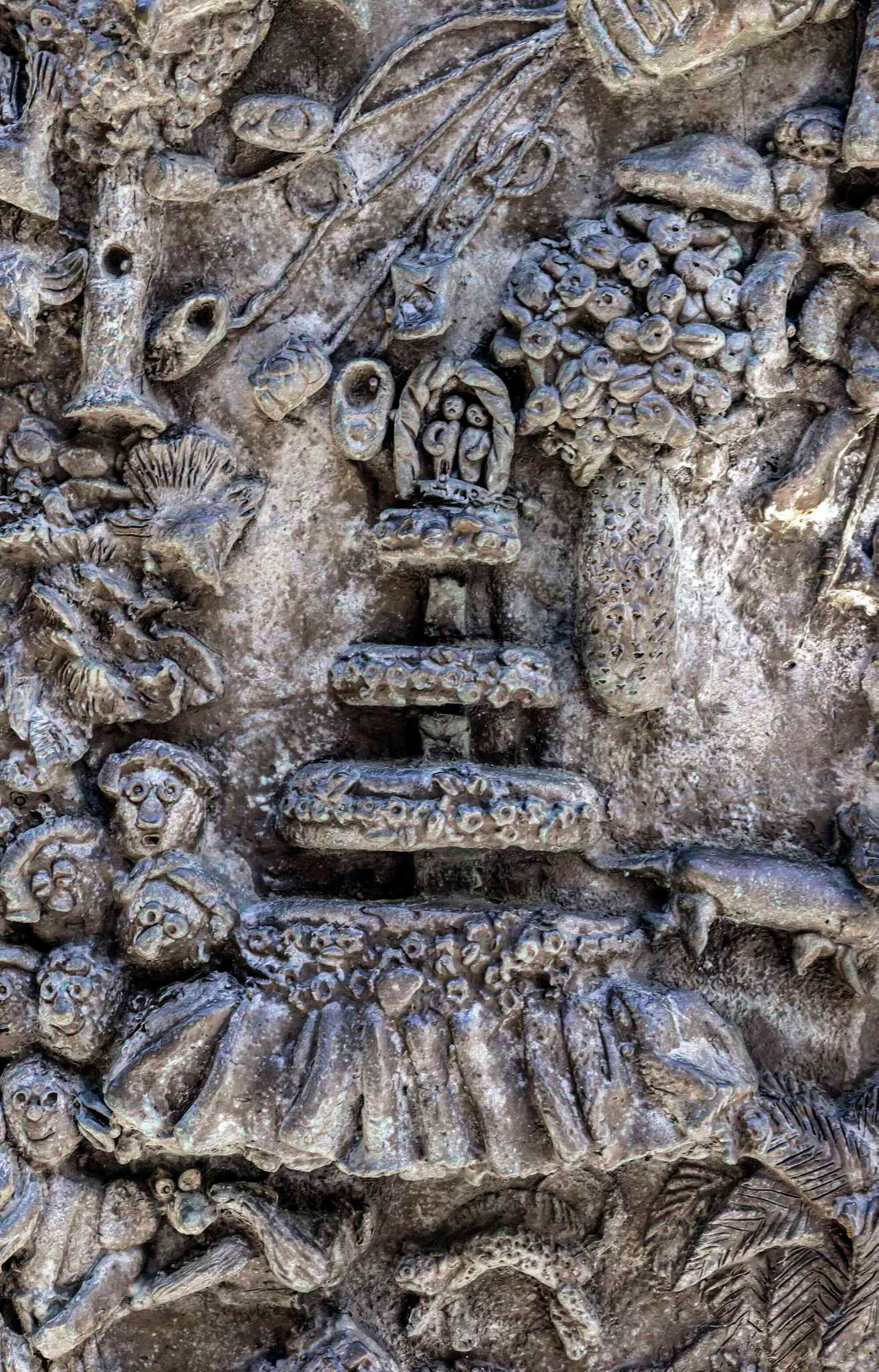 A detail photo of Ruth Asawa's "San Francisco Fountain" shows a multi-tiered wedding cake with a cake topper that depicts the real wedding of Asawa's daughter Aiko to Larry Cuneo.