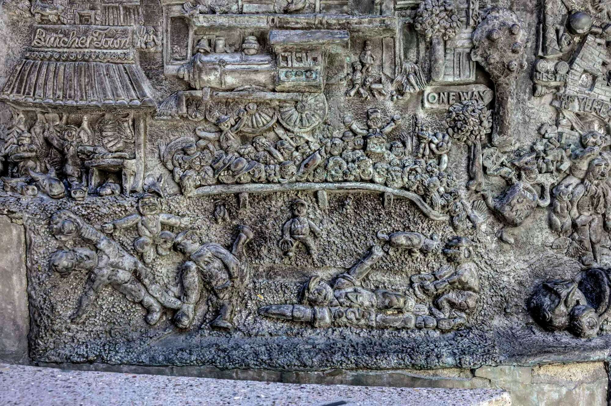 A detail photo of Ruth Asawa's "San Francisco Fountain" shows a baseball scene with pitcher Juan Marichal with his high leg kick and Willie Mays sliding into home.